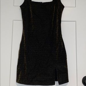 Tight fitting black with gold glitter dress
